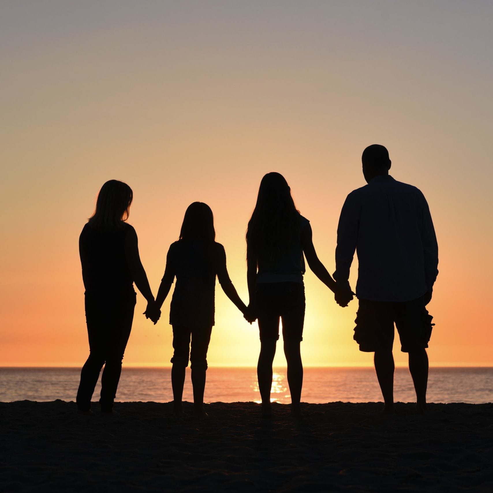 family silhouette sunset